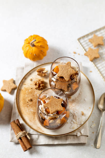 Chocolate pumpkin mousse in glasses with cookies