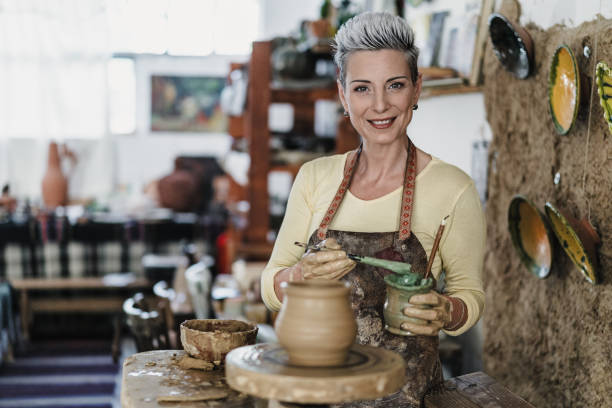 istock Female artist working on potters wheel 2175733429