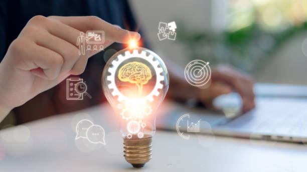 istock Man touches an illuminated lightbulb glowing to Starting New ideas, innovation and inspiration, smart intelligent creativity, Motivation, and innovation concept. 2175757569