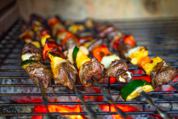istock Meat steak skewers kebab cooking on a grill. 2175758359