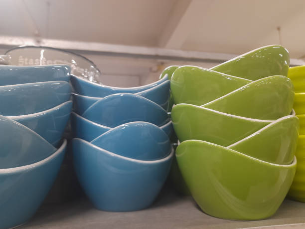 A pile of colorful ceramic bowls in the shop