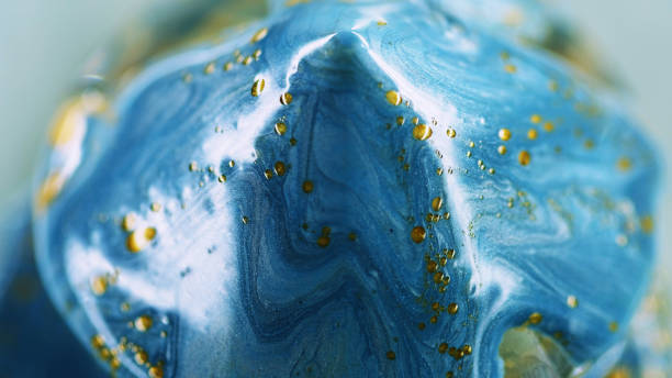 istock Ink pyramid sparkling paint drop blue golden oil 2175766914