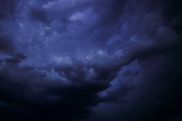 Cloudy Sky With Blue Dark Storm Clouds During Rain. Natural Background With Rainclouds. natural weather background dark blue backdrop thunderstorm stormy sky. abstract-background-design, abstract-backgrounds, summer-background, summer background