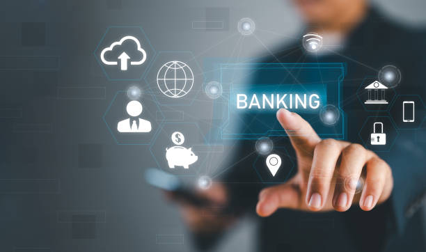 istock Businessman holding word banking in hand with icon network connection on virtual screen dark background 2175779173