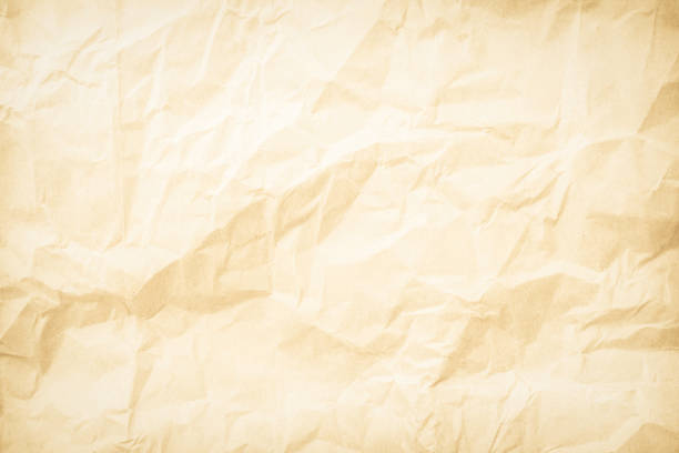 Old paper vintage texture surface for background. Recycle pale brown paper crumpled texture, Cream color recycled kraft paper texture blank with copy space for text.