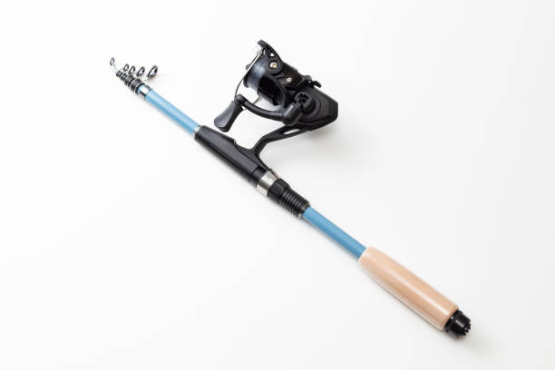 Fishing rod and reel on a white background.