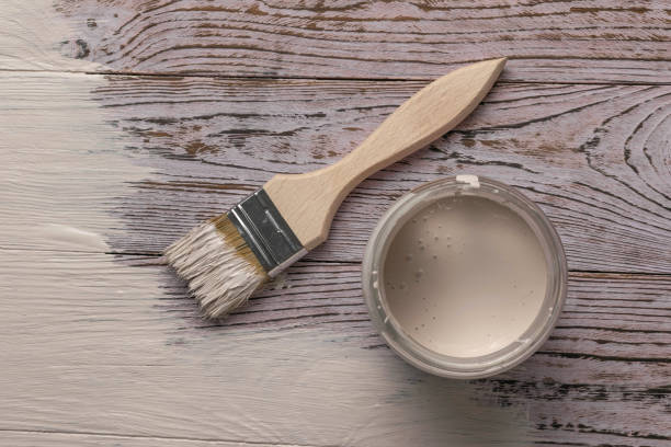 istock Painting a Wooden Surface with White Paint Using a Brush - Home Improvement and DIY Project 2175788001