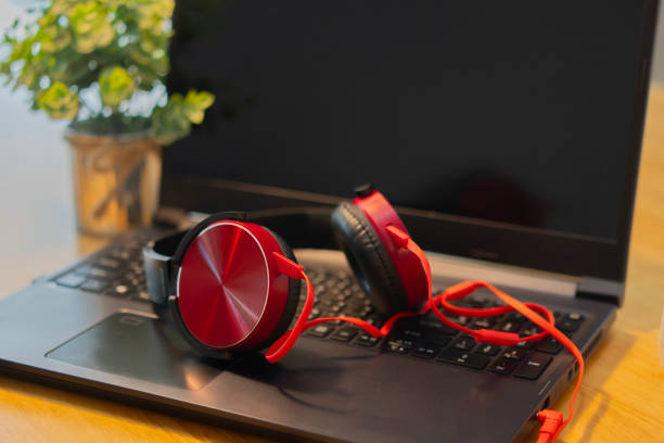 Workplace, laptop computer with headphones headset. Business, technology, working from home, conference, studying, e-learning, meeting online, chat, call center concept