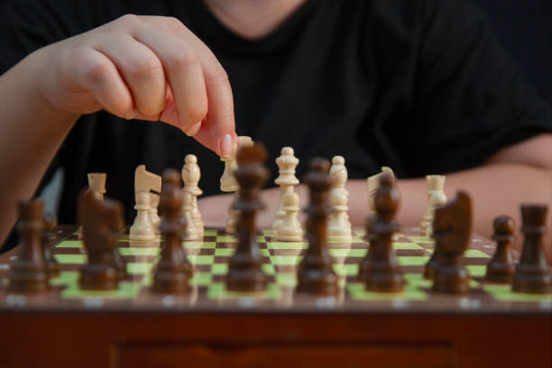istock Hand moving the pawn in chess game 2175799719