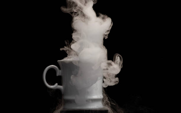 istock Coffee cup filled with strange swirling fog and vapour creating unique patterns and shape rising and falling from cup 2175800605
