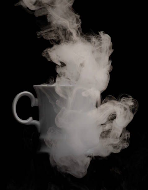istock Coffee cup filled with strange swirling fog and vapour creating unique patterns and shape rising and falling from cup 2175800610