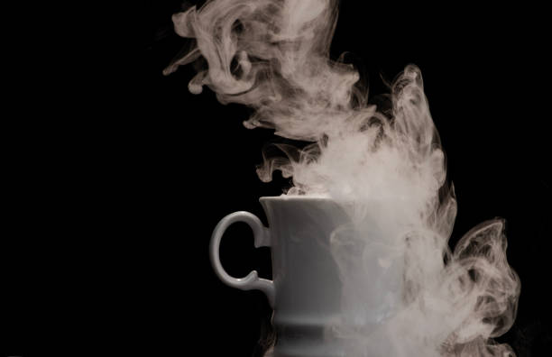 istock Coffee cup filled with strange swirling fog and vapour creating unique patterns and shape rising and falling from cup 2175800619