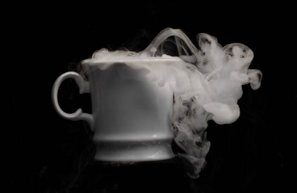 istock Coffee cup filled with strange swirling fog and vapour creating unique patterns and shape rising and falling from cup 2175800630