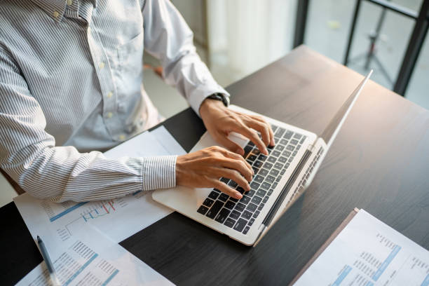 istock Business man working using laptop computer Hands typing keyboard. Professional investor working start up project. business planning in office. Technology business 2175804352