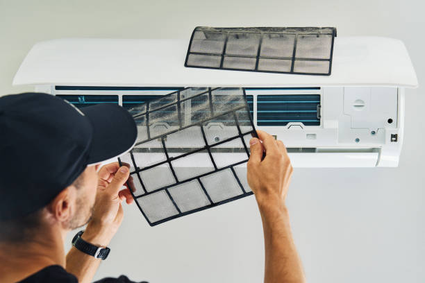 istock Air conditioner maintenance. Male technician repairing cooling system 2175804438