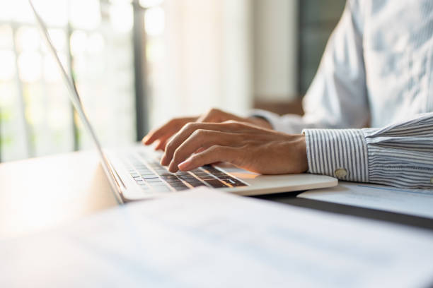 istock Business man working using laptop computer Hands typing keyboard. Professional investor working start up project. business planning in office. Technology business 2175804737