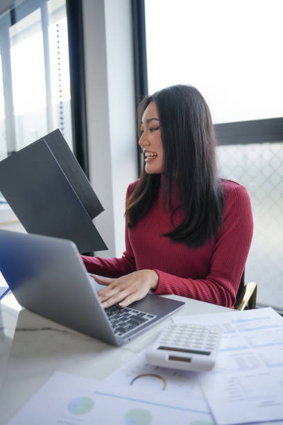 istock Beautiful Business Woman working by using laptop computer Hands typing on keyboard. Professional investor working new start up project. business planning in office. Technology business Concept. 2175804844