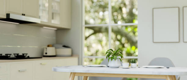 istock A close-up of a luxury white dining table in a modern white kitchen. 2175805593