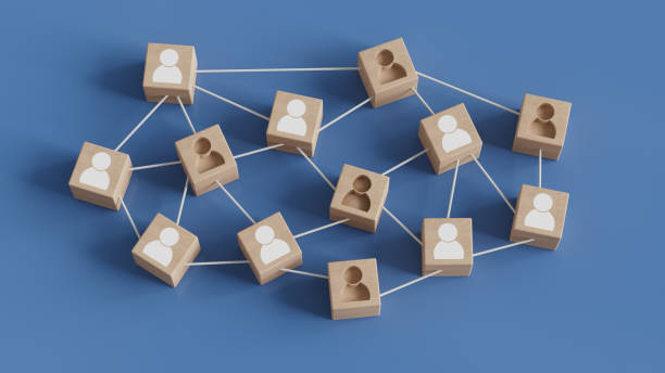 istock Wooden blocks with people icon on blue background. Organization structure, social network, leadership, team building, recruitment, management or human resources hiring concepts. 2175805594
