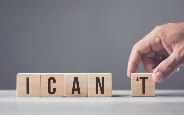istock A hand separates the letter T from the word can't, transforming it into can. The image symbolizes overcoming obstacles, shifting from doubt to empowerment, and embracing a positive mindset. 2175808152