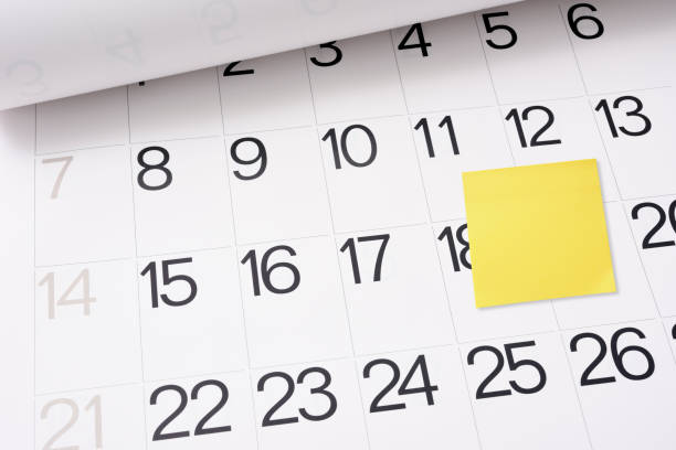 istock Calendar page with blank yellow sticky note 2175810163
