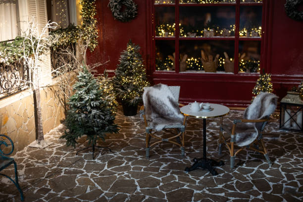 istock Brightly illuminated christmas decorations cafe. Outside decor for winter holidays 2175812858
