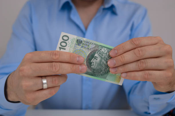 istock A man holding a paper banknote in his hand 2175815848