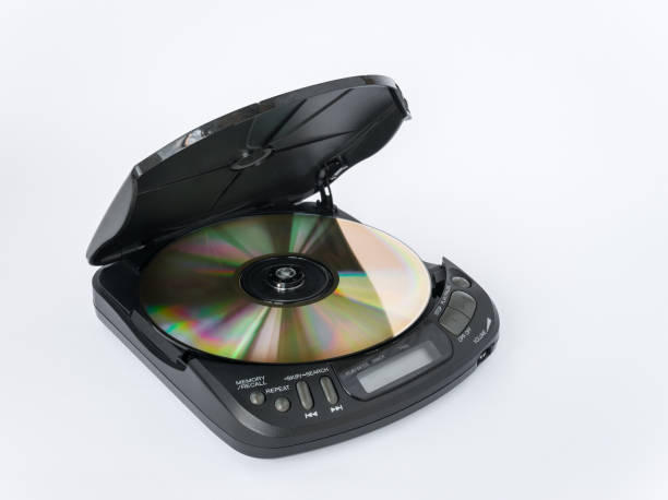 istock Close-up view of CD player with open lid and golden CD inside isolated on white background 2175816876