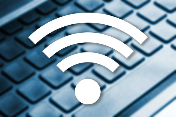 istock WiFi symbol on a laptop keyboard background. Wireless network access and Internet connection concept. 2175818594