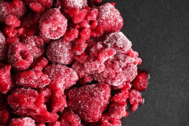 frozen raspberry texture close up for background and your text