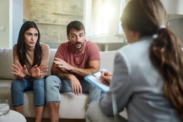 istock Displeased couple having a counseling session with therapist. 2175820431