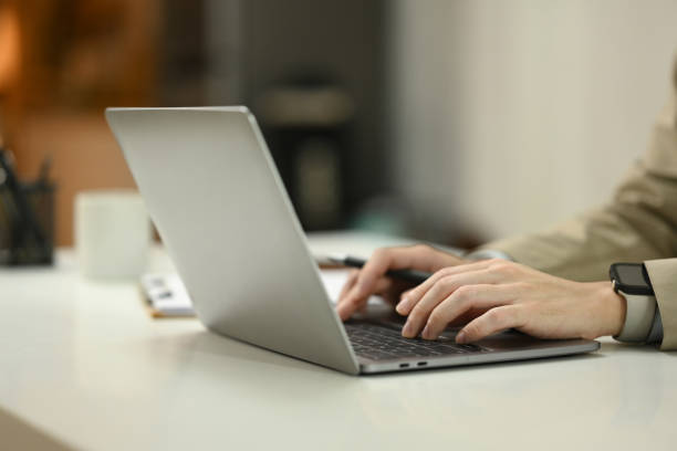 istock Close up unrecognizable businessman hands typing on a laptop computer 2175822867