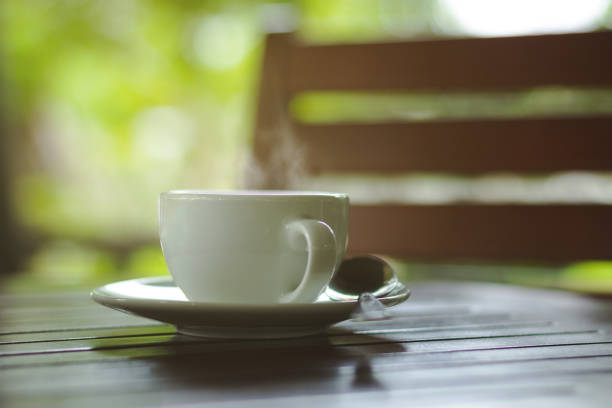 drinking coffee by the window