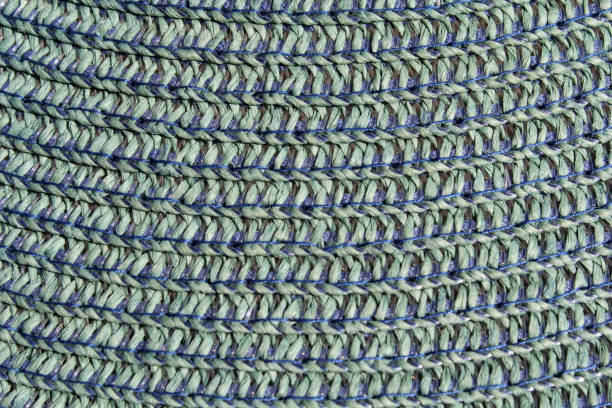 Seamless knitted texture in floral style. The pattern is crocheted from multicolored cotton yarn. Yellow-orange color combination.