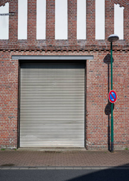 istock Rolling garage door and brick wall 2175828293
