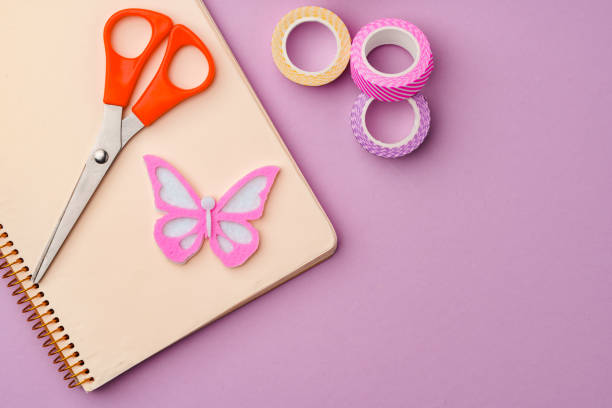 istock Crafting supplies on a purple background ready for creative projects 2175835754