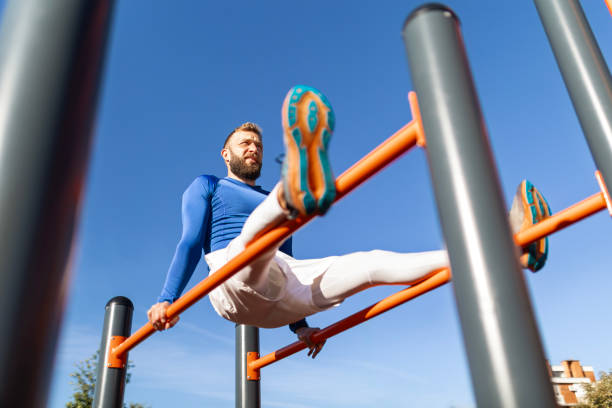istock Young Man Working Out on Bars in Street Gym 2175837426