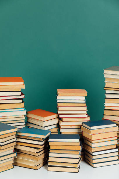istock Stacks of educational books for learning in the library as a background 2175838138