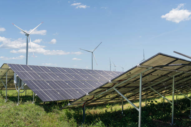 istock Solar panels and wind turbines on a field. Sustainable energy. 2175838367