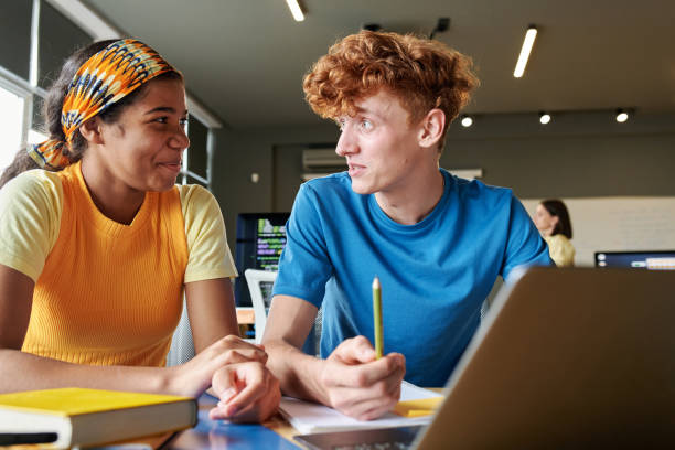 istock Students Sitting at Desk with Laptop 2175838476