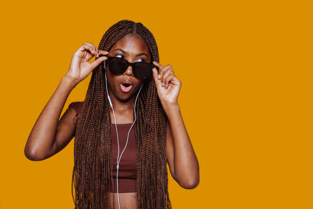 istock African young girl puts on sunglasses 2175844509