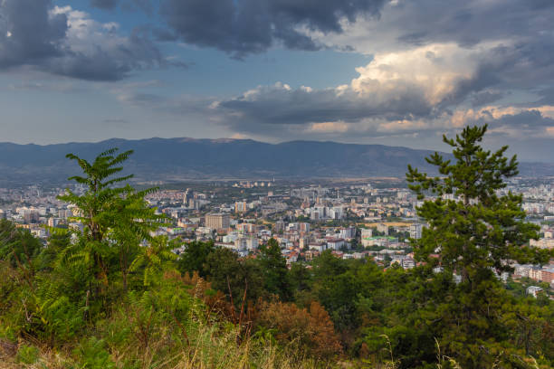 istock Dramatic cityscape panorama overlooking green hills 2175847212