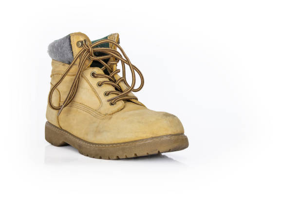 A pair of steel cap work boots isolated on white.