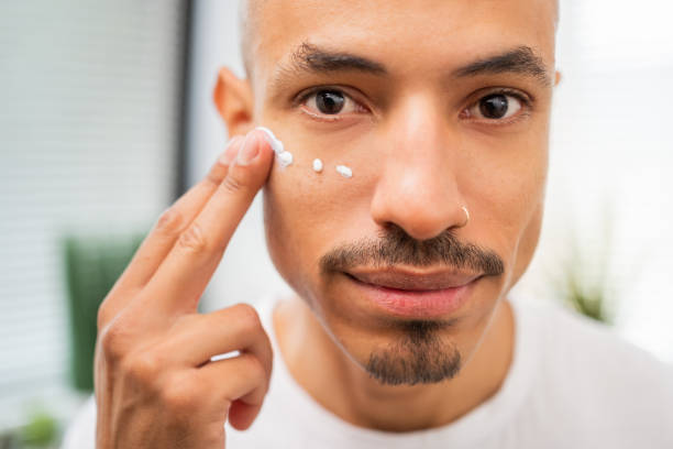 istock Man Applying Skincare Cream on Face 2175855047