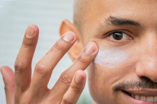 istock Man Applying Skincare Cream on Face 2175855311