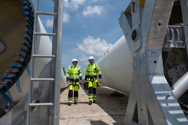 istock Wind Turbine Maintenance and Repair Technician, Engineer Checking Turbines working maintenance clean power generator system 2175857246