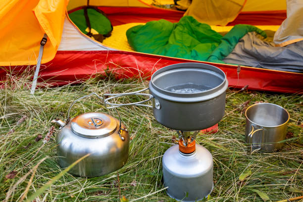 istock Camping with a tent and cooking equipment in the mountains. 2175860049