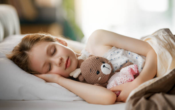istock child is sleeping in the bed 2175861168