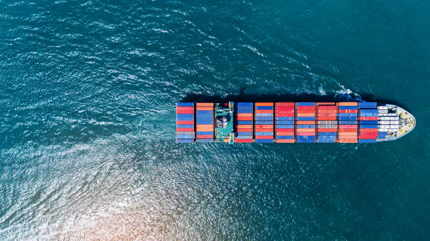 istock Cargo container ship carrying container and running out from international container port customs shipyard sea port concept smart logistic service. Container Ship freight export 2175866259