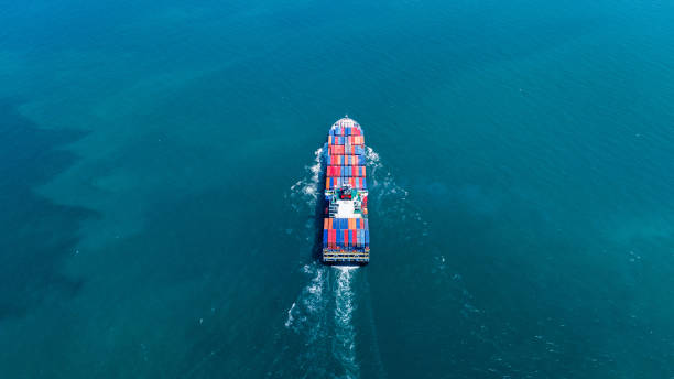 istock Cargo container ship carrying container and running out from international container port customs shipyard sea port concept smart logistic service. Container Ship freight export 2175866282